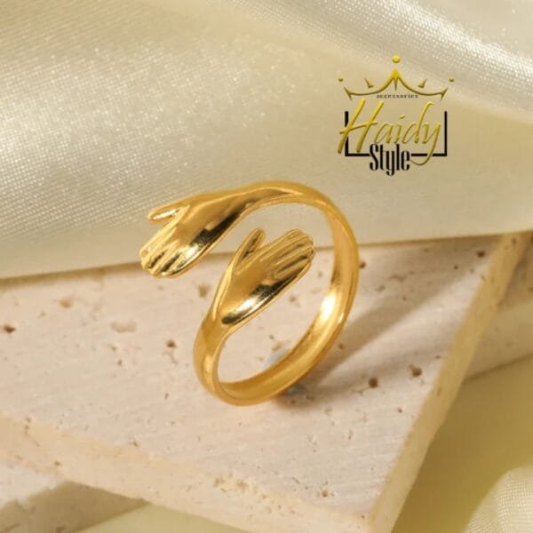 Ring stainless steel hugging hand gold color