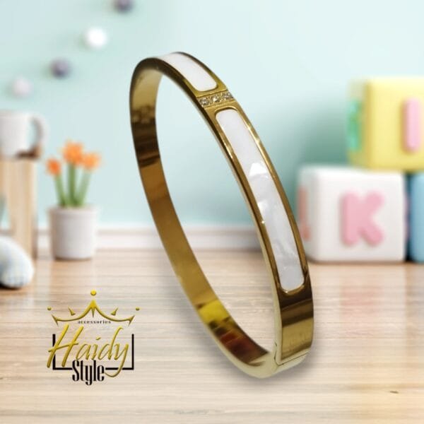 Bangle stainless steel 18k gold plated with two white bezels with sparkling stones in the middle